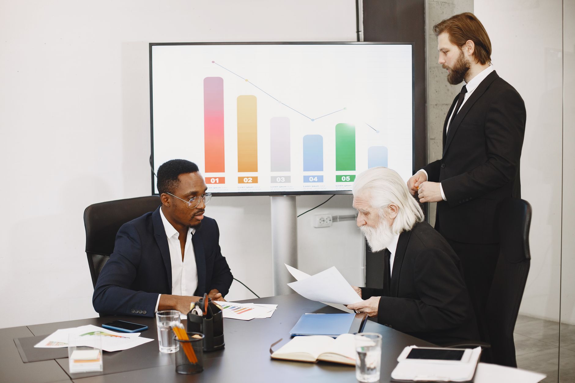 Business consultation meeting in progress with charts